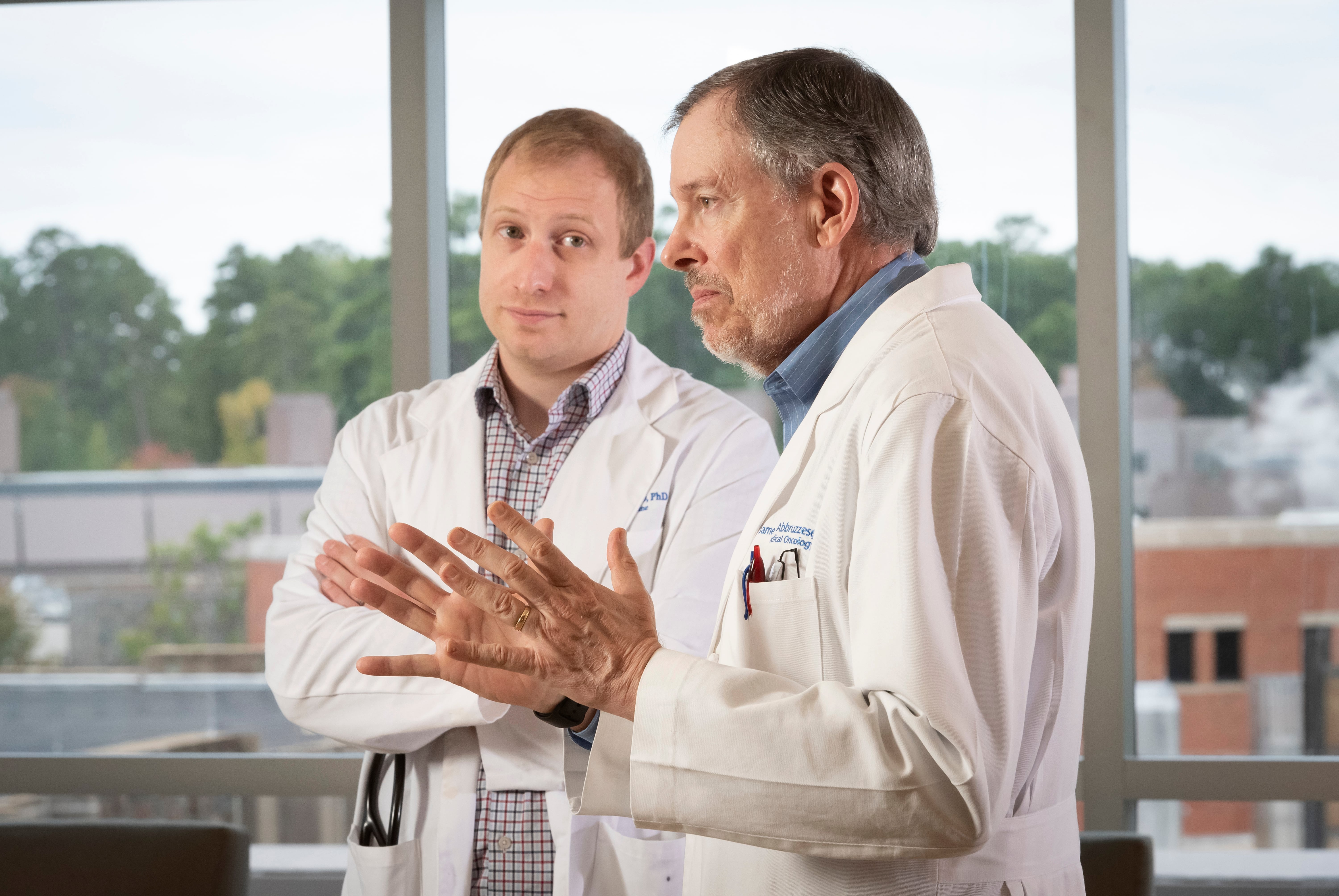 Hematology/oncology fellow Ryne Ramaker (left), and clinician Jim Abbruzzese aim to translate a potential early diagnostic test for pancreatic cancer from the lab to the clinic. Photo by Les Todd.